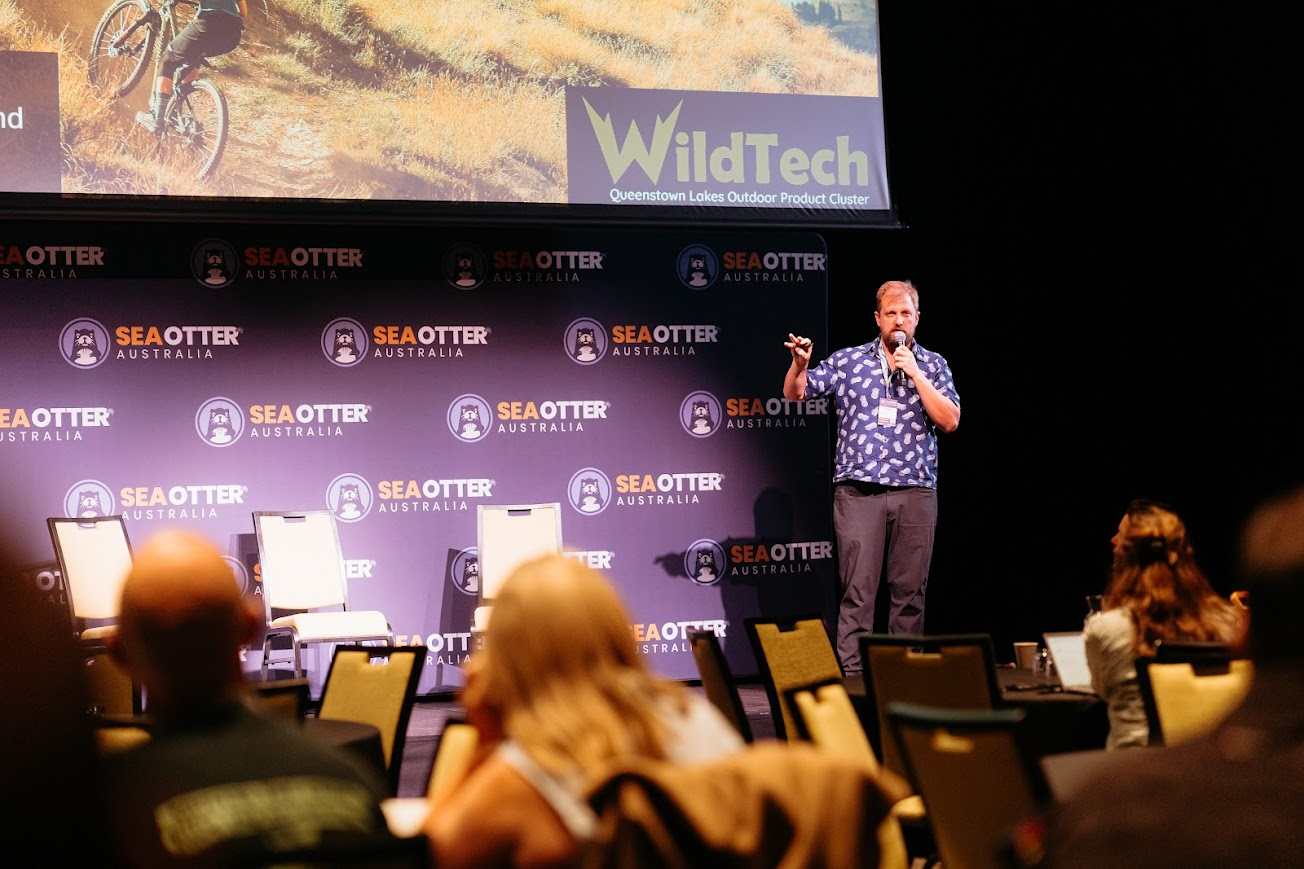 Amos Breyfogle speaking on stage at Sea Otter Australia